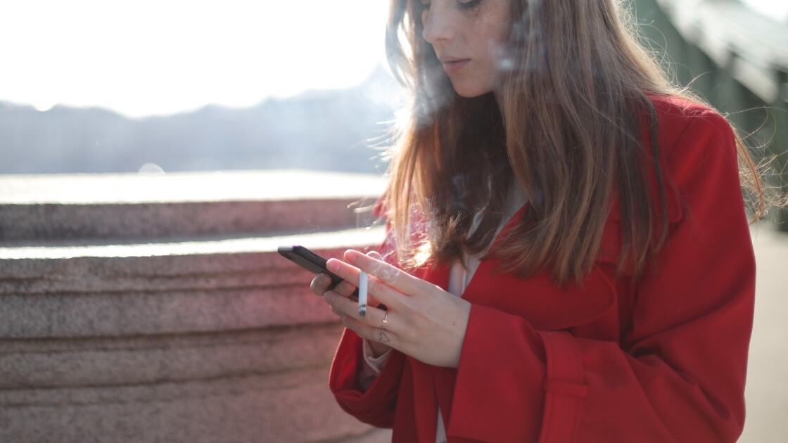 woman in red searching for cigarettes on online